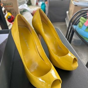Yellow patent leather high heels only worn once for a wedding.